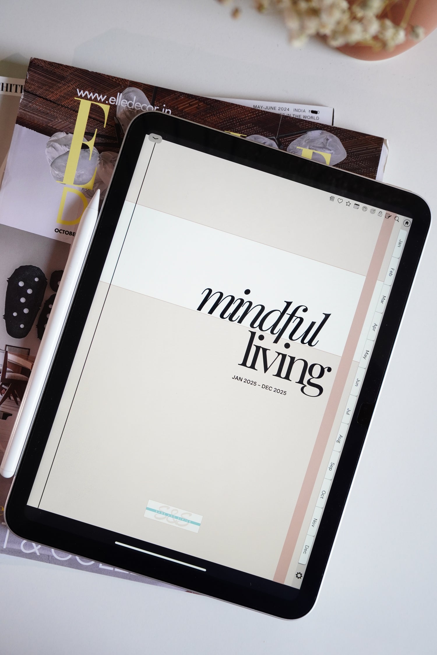 A portrait of the mindful living digital planner open in iPad on a study table