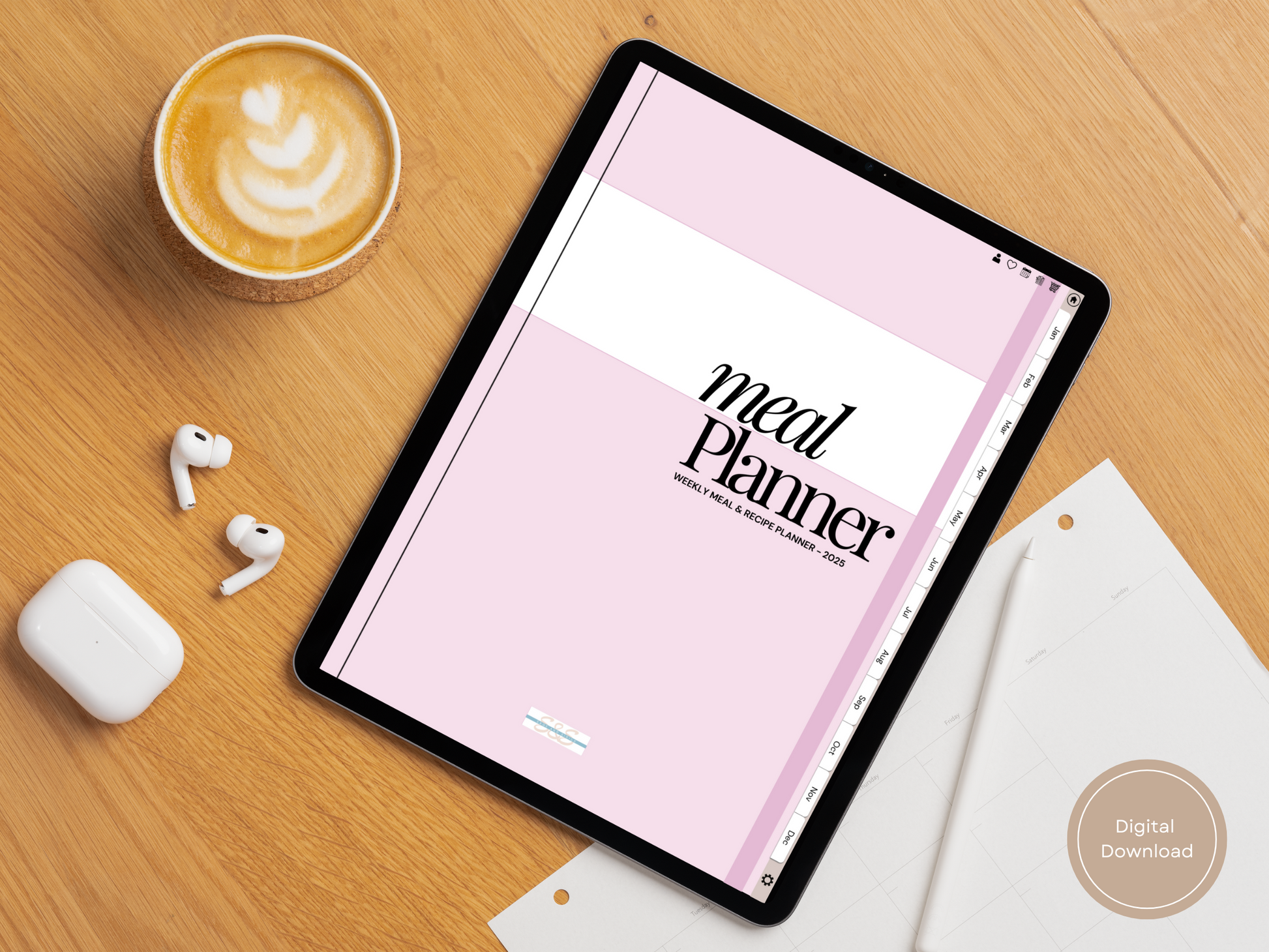 Digital Meal Planner and Recipe Tracker on a tablet with coffee and earbuds nearby.