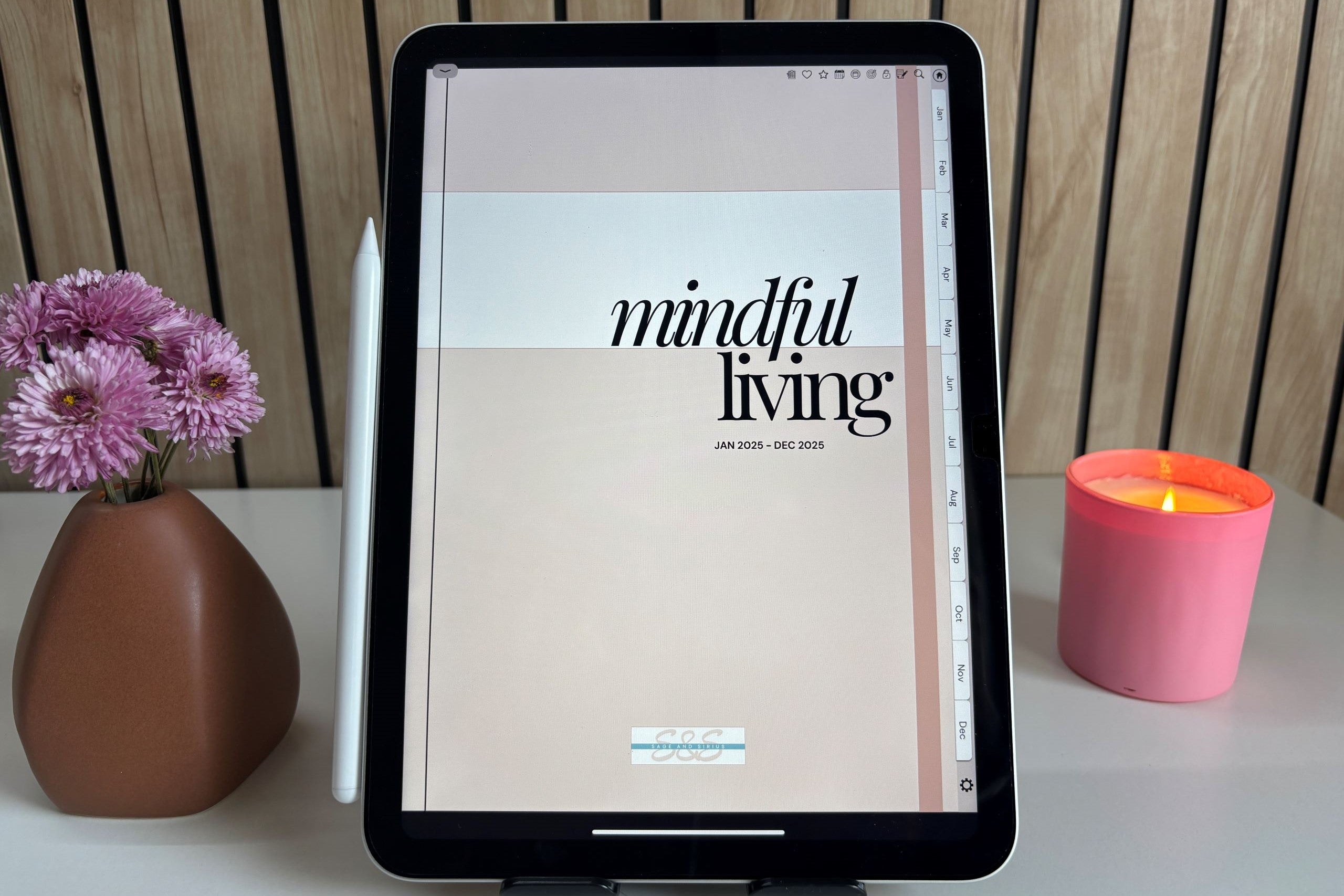 An image of an iPad on a study table displaying the cover page of the Mindful Living digital planner for iPad.